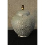A contemporary porcelain lamp with applied decoration. H.40 Dia.30cm.