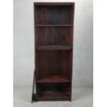 A contemporary floor standing stained teak open bookshelf raised on plinth base. H.203 W.76 D.40cm