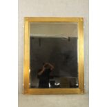 A contemporary 20th century guilded rectangular wall mirror with reeded decoration. H.140 W.110cm.