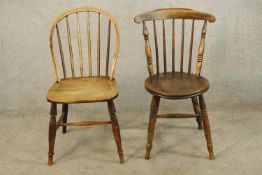 An early 20th century spindle back Windsor style chair raised on turned supports and 'H' stretcher