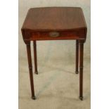 A George III mahogany Pembroke table raised on turned supports terminating in casters. H.72 W.94 (