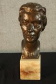 A bronze female bust study raised on rectangular alabaster base, unsigned. H.42cm.