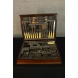 An early 20th century mahogany cased canteen of silver plated cutlery. H.10 W.50 D.38cm. (box)