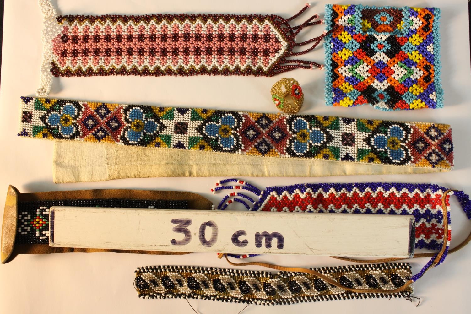 A collection of seven pieces of Danish beadwork, each with geometric patterns. L.56cm. (largest0 - Image 2 of 2