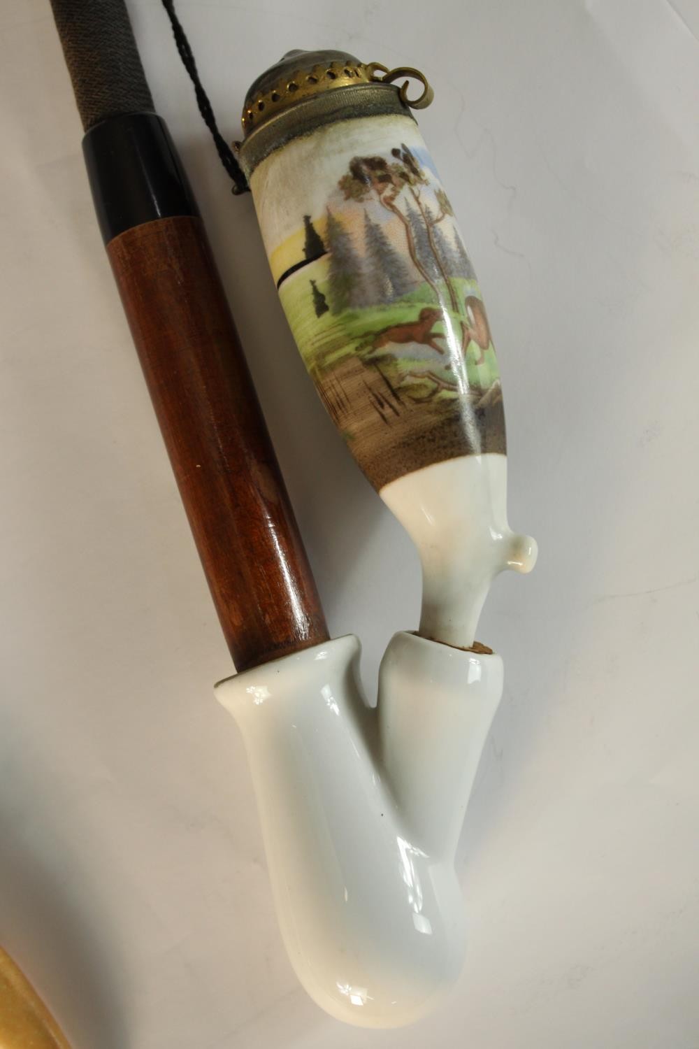 A 20th century porcelain pipe together with a white metal and ivorine letter opener in the form of a - Image 5 of 6