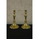 A pair of French Louis XV brass octagonal candlesticks raised on octagonal bases. H.24cm.