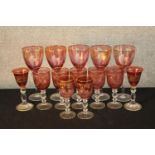 A set of ten 19th century cranberry glass drinking glasses together with four other ruby glass