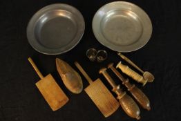 A pair of 19th century pewter dishes, together with a small quantity of turned wooden tools. H.4