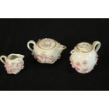 A late 19th/early 20th century Meissen porcelain floral encrusted miniature teapot, water jug and