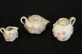 A late 19th/early 20th century Meissen porcelain floral encrusted miniature teapot, water jug and