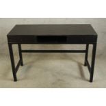 A 20th century black painted pine two drawer console table raised on square supports. H.76 W.118 D.