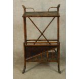 A late 19th century floor standing bamboo magazine rack raised on splayed supports. H.91 W.50 D.