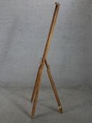A contemporary beech floor standing adjustable easel raised on three splayed supports. H.150 W.55