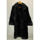 A 20th century ladies B.C. Winterson black fur ladies full length ladies coat. L.116cm.