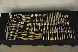 An assortment of silver plated and other flatware to include knives, forks and spoons. L.25cm. (