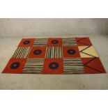 A 20th century abstract woollen rug, allover modernist geometric design. L.195 W.136cm.