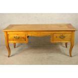 A late 18th century French marrisia cherrywood dressing table/writing desk with two short drawers