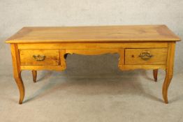 A late 18th century French marrisia cherrywood dressing table/writing desk with two short drawers