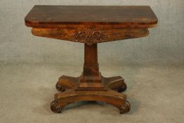 A William IV mahogany foldover card table, the central rectangular shaped column raised shaped