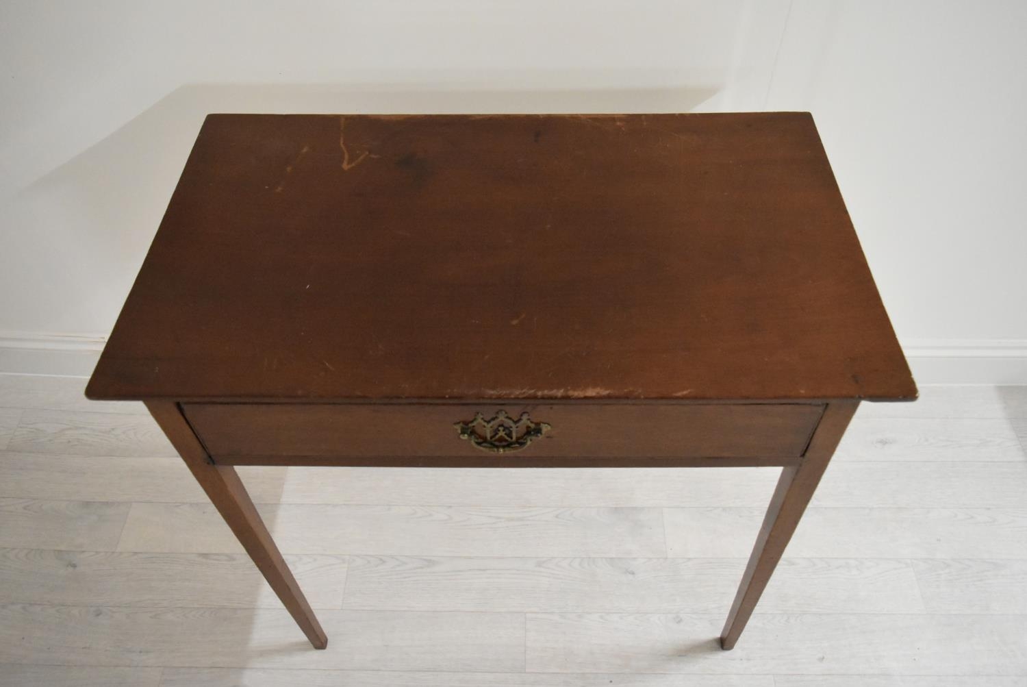 An Edwardian mahogany single drawer hall table raised on square tapering supports. H.76 W.77.5 D. - Image 2 of 7