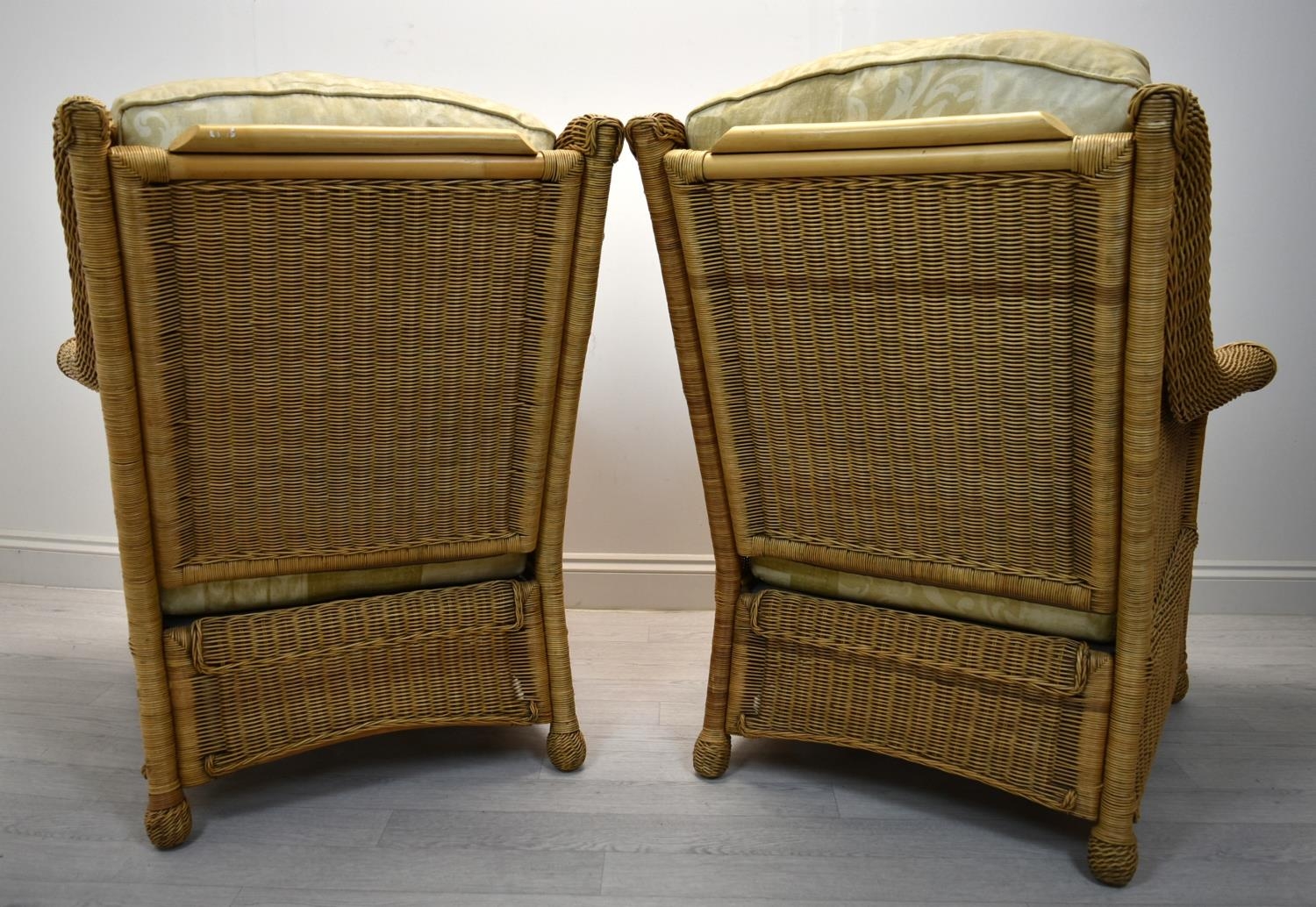 A pair of contemporary cane conservatory armchairs each with loose cushions. H.98 W.82cm - Image 4 of 5