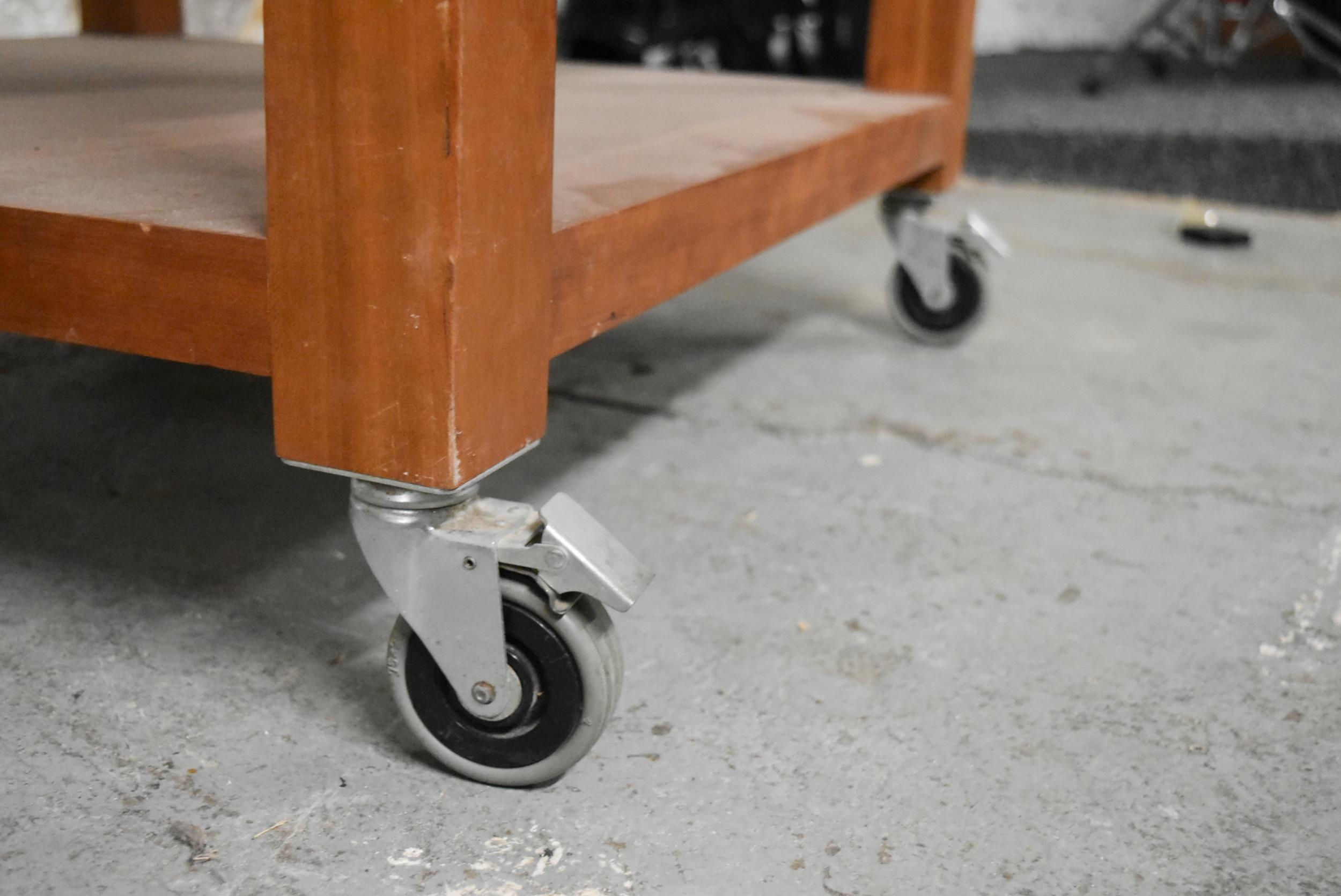 A contemporary hardwood low table on casters. H.48 x W.72 x D.72cm - Image 5 of 5