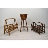 Two mid 20th century bamboo magazine stands together with a mid 20th century wicker plant stand