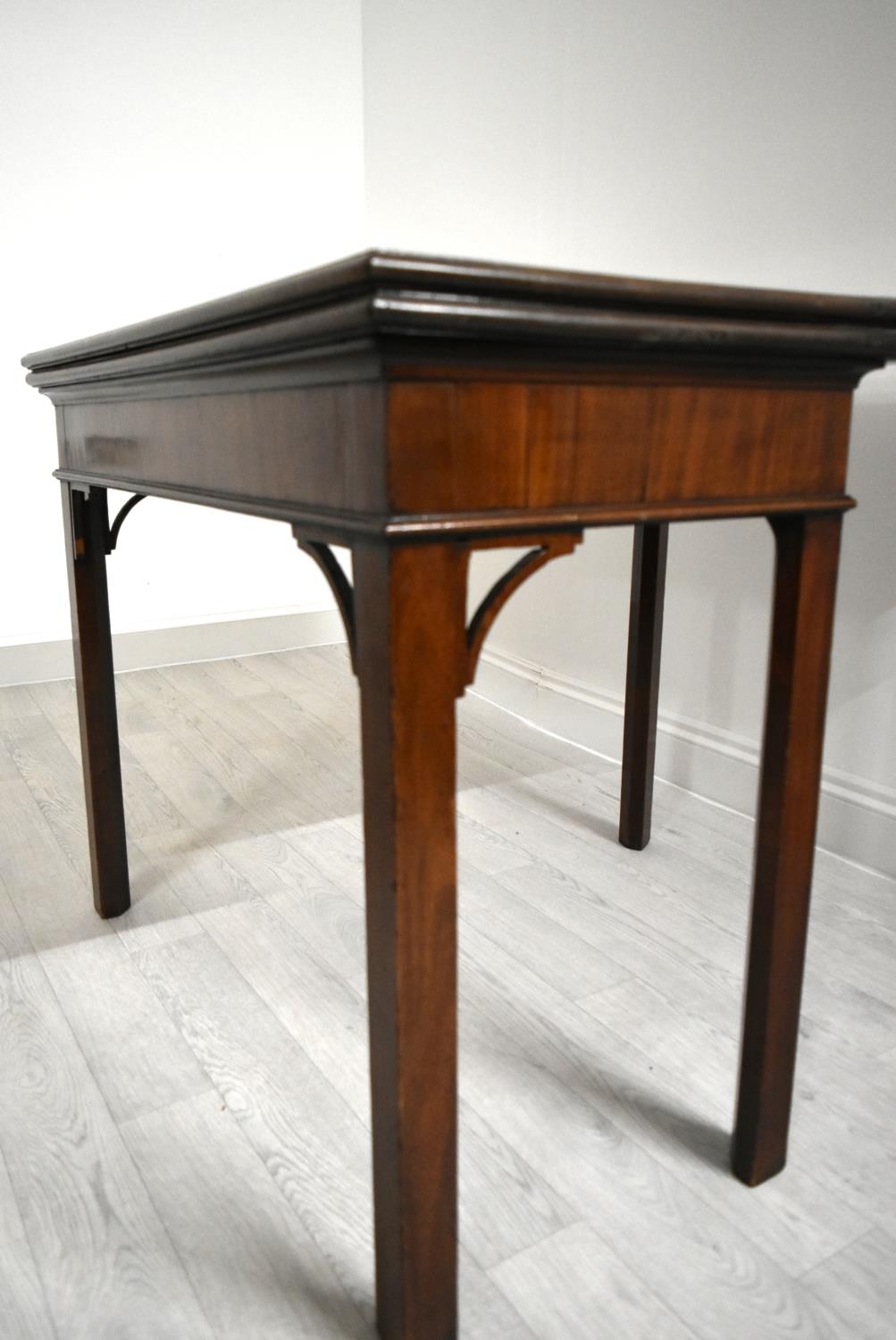 A George III mahogany rectangular fold over table raised on square supports. H.75.5 W.92.5 D.45. - Image 6 of 11