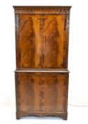 An early 20th century Georgian style inlaid mahogany twin door display cabinet opening to reveal