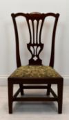 A 19th century mahogany pierced splat back nursing chair with upholstered drop in seat raised on