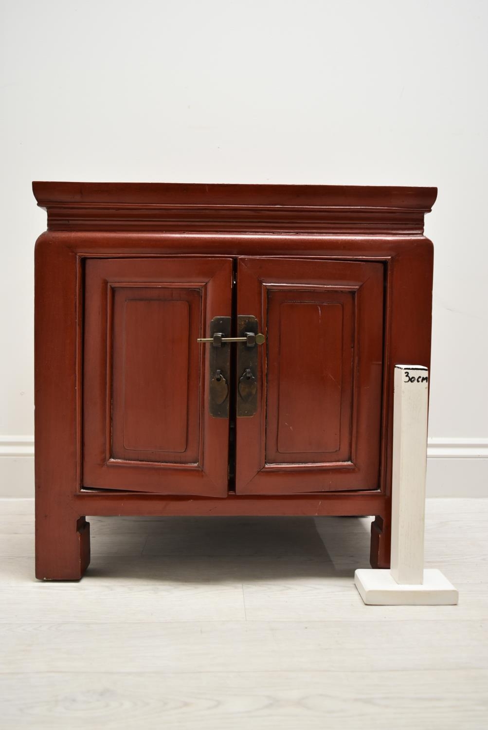 A Chinese style red painted twin door bedside cupboard opening to reveal shelves and single - Image 7 of 7