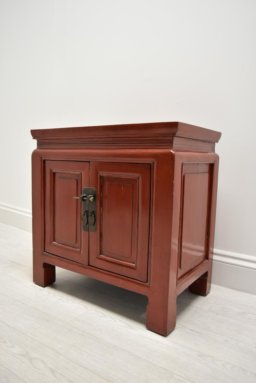 A Chinese style red painted twin door bedside cupboard opening to reveal shelves and single - Image 3 of 7