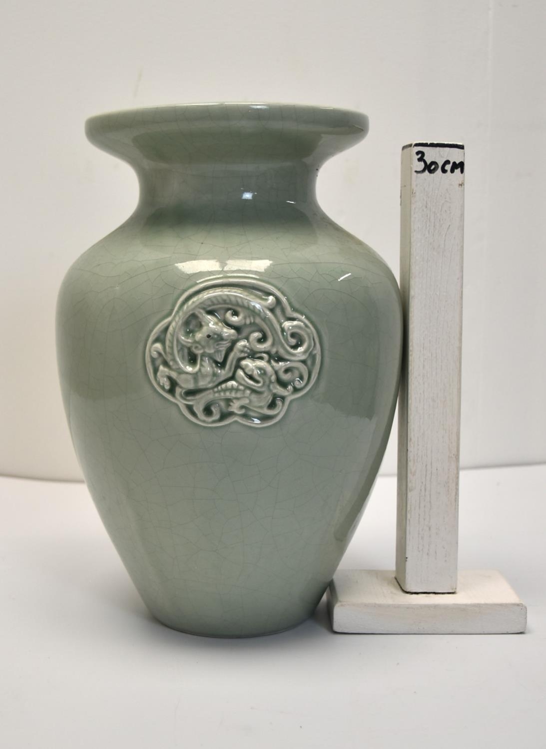 A Chinese green celadon crackle glaze baluster vase with incised mythical creature decoration. H. - Image 2 of 2