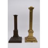 A gilt brass Corinthian column light fitting raised on stepped square base together with a patinated