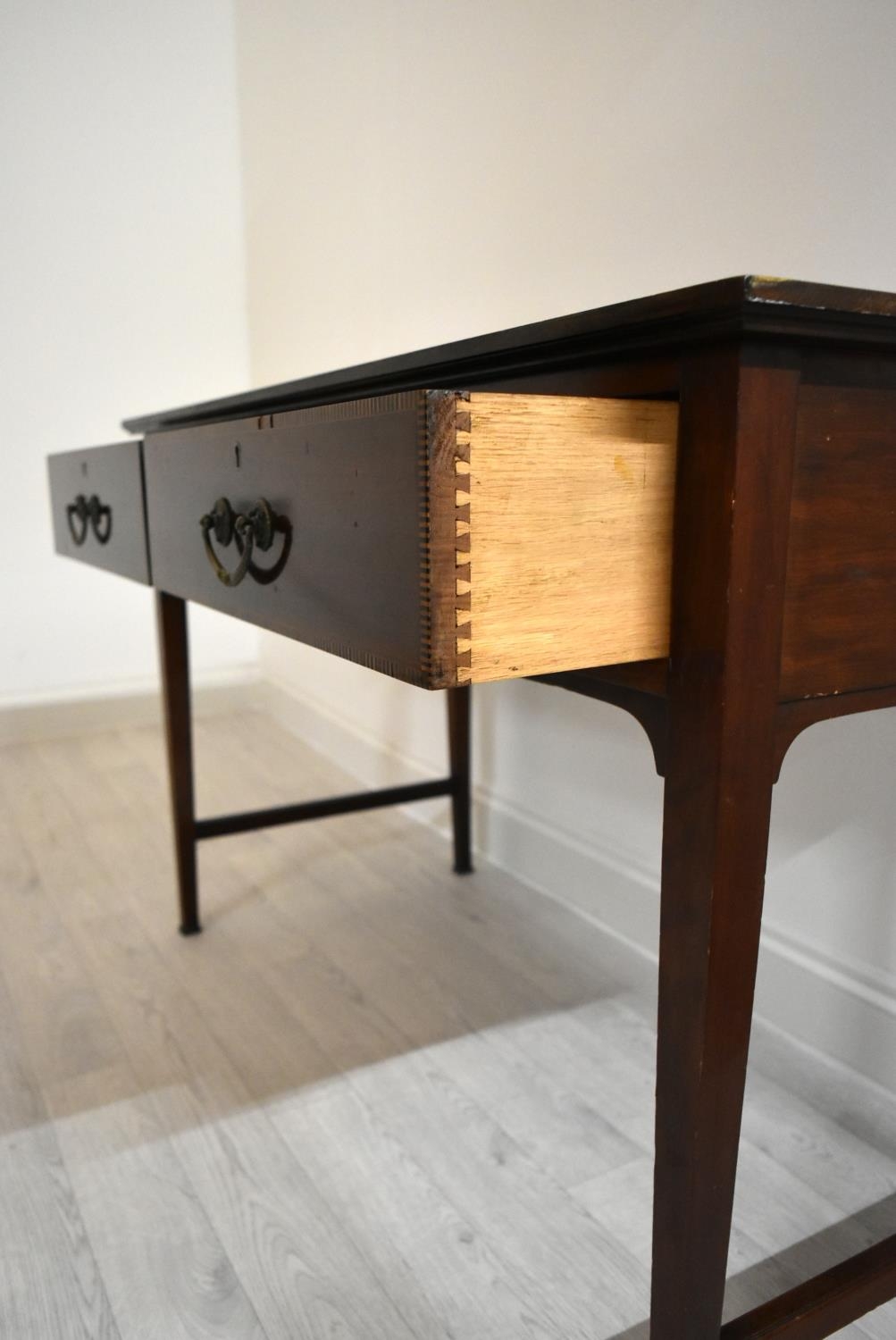 An Edwardian inlaid mahogany two drawer hall table raised on tapering supports terminating in pad - Image 5 of 14
