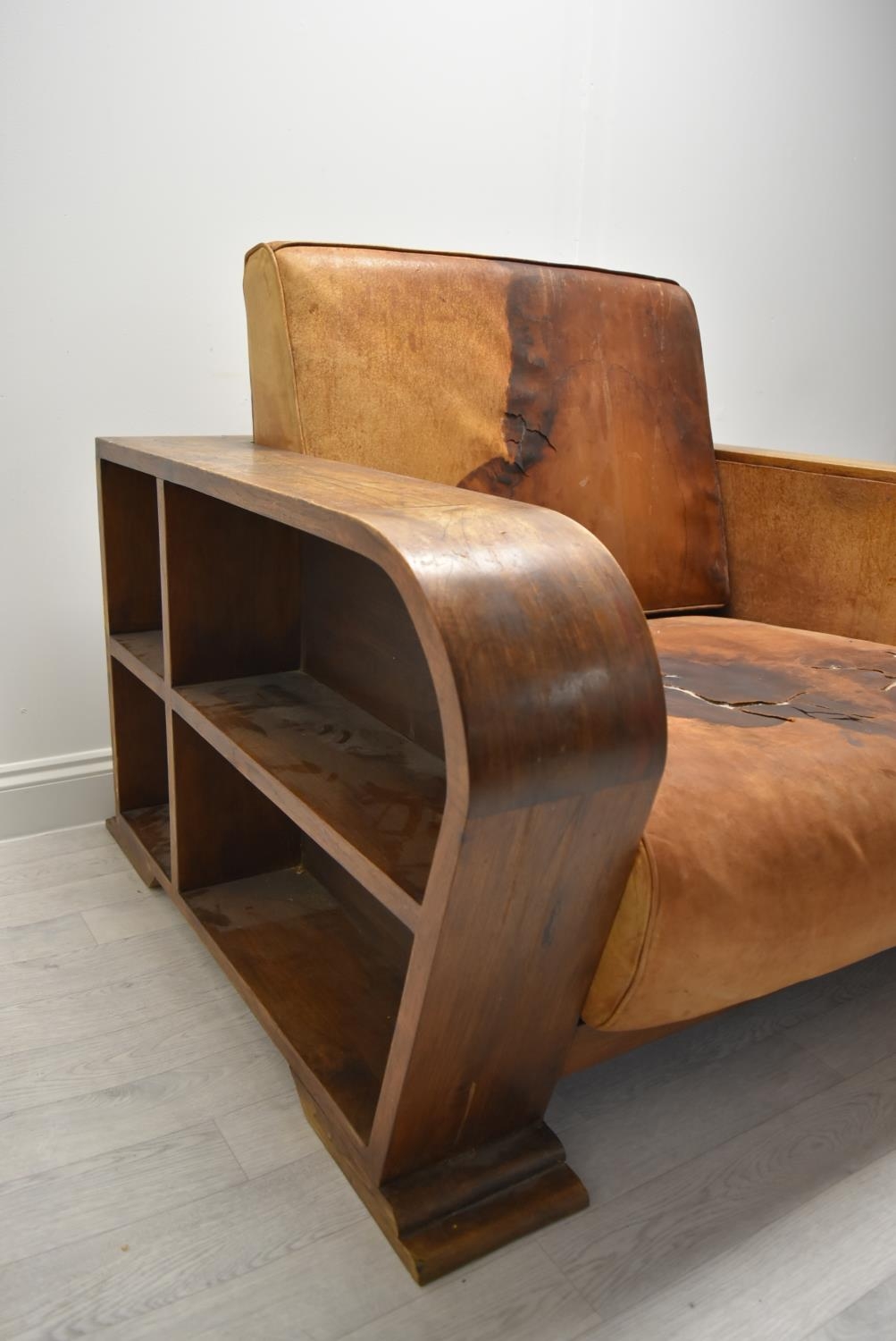 A walnut framed Art Deco leather armchair, the arms and back with integrated shelves. H.86.5 W.111.5 - Image 6 of 7