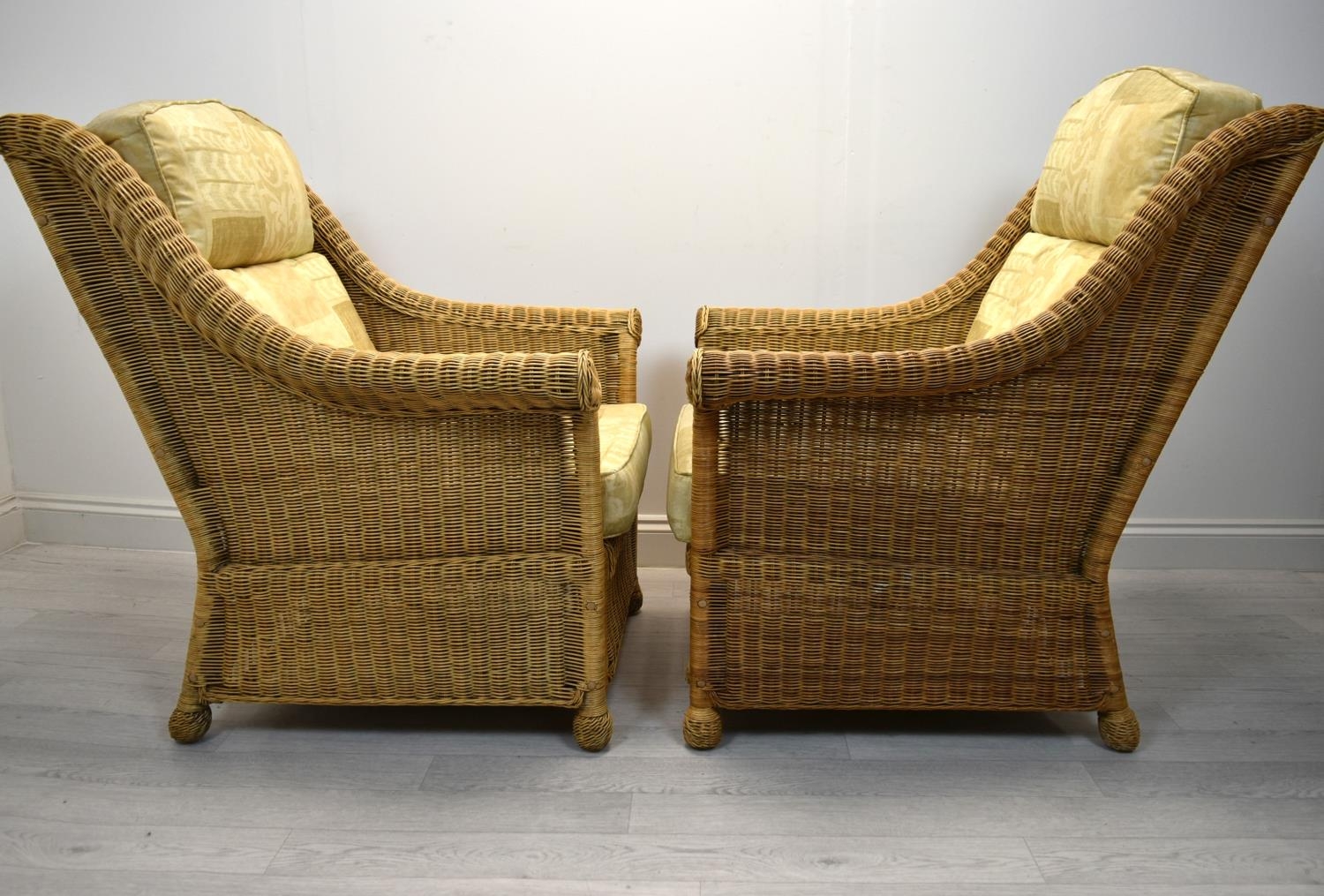 A pair of contemporary cane conservatory armchairs each with loose cushions. H.98 W.82cm - Image 3 of 5