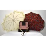 Two 20th century ladies parasols together with a ladies travelling vanity case by Lancôme.