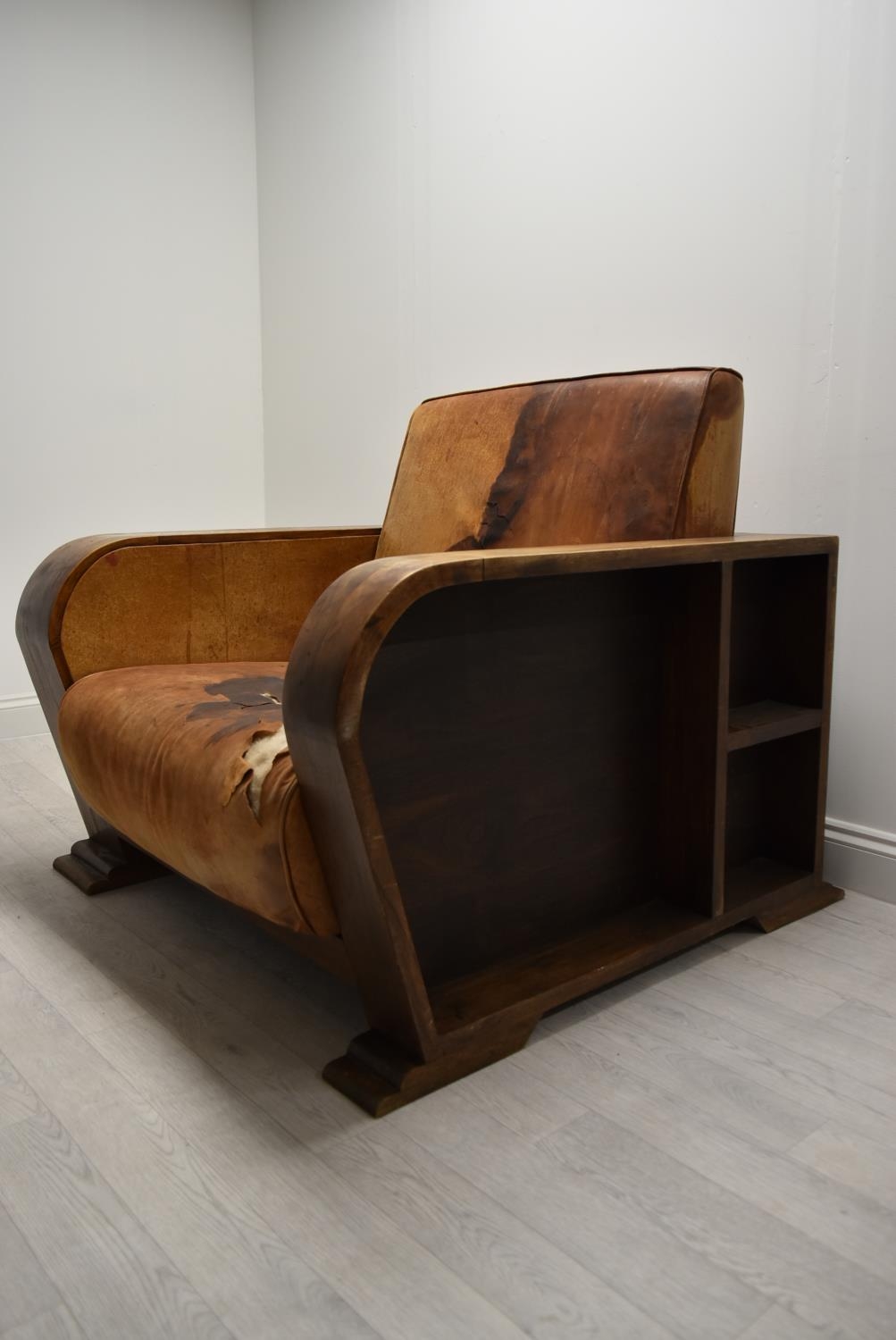 A walnut framed Art Deco leather armchair, the arms and back with integrated shelves. H.86.5 W.111.5 - Image 4 of 7