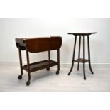 A 20th century stained mahogany drop flap drinks trolley with separate butlers tray together with an