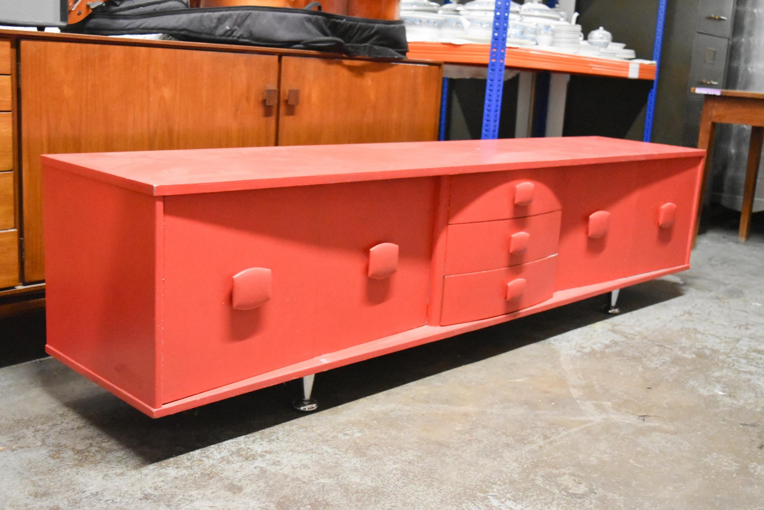 A mid century teak sideboard, later painted. L.212 x D.43 H.53cm