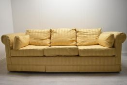 A contemporary three seater sofa bed upholstered in yellow dralon fabric. H.72 W.220 D.94cm
