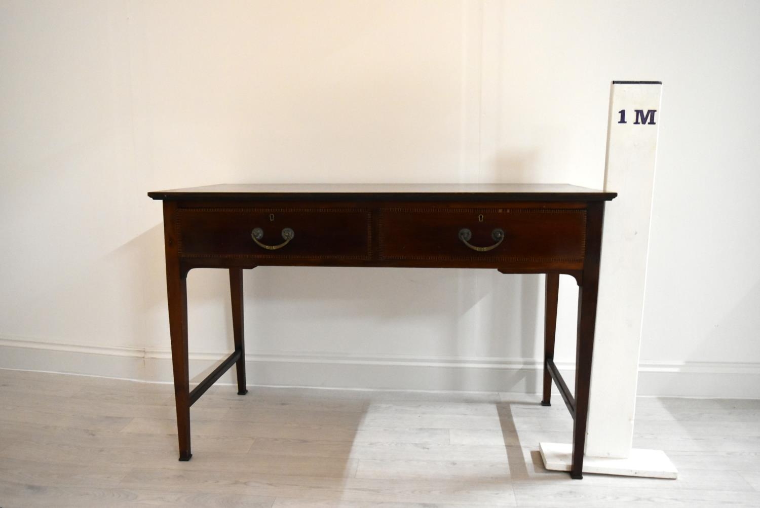 An Edwardian inlaid mahogany two drawer hall table raised on tapering supports terminating in pad - Image 3 of 14