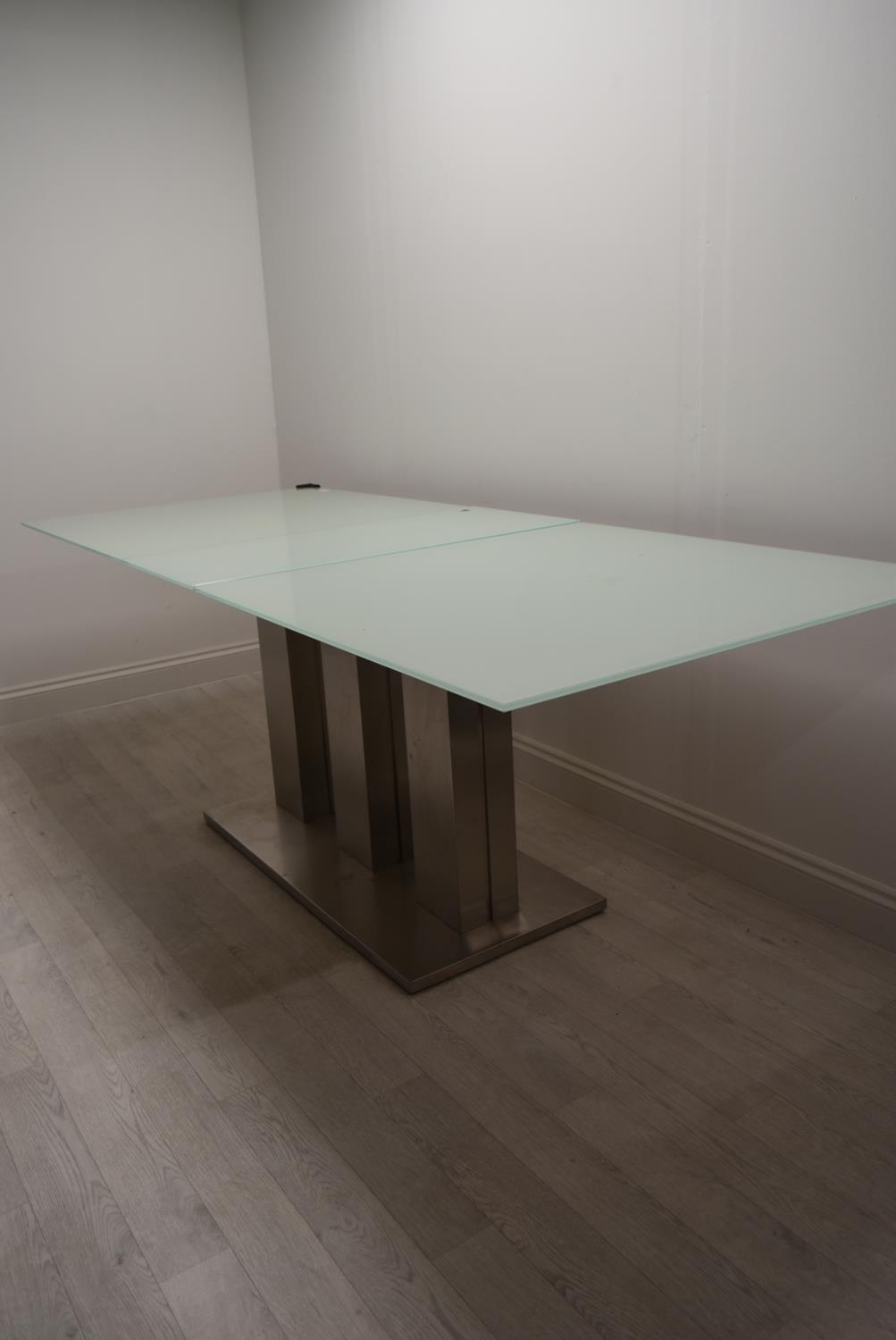 A contemporary extending glass dining table on brushed metal base. H.76 W.221 D.90cm - Image 4 of 21