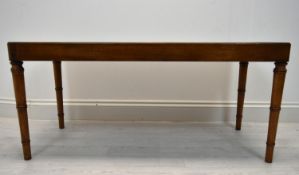 A Georgian style rectangular mahogany coffee table raised on turned supports H.46 W.101 D.45cm