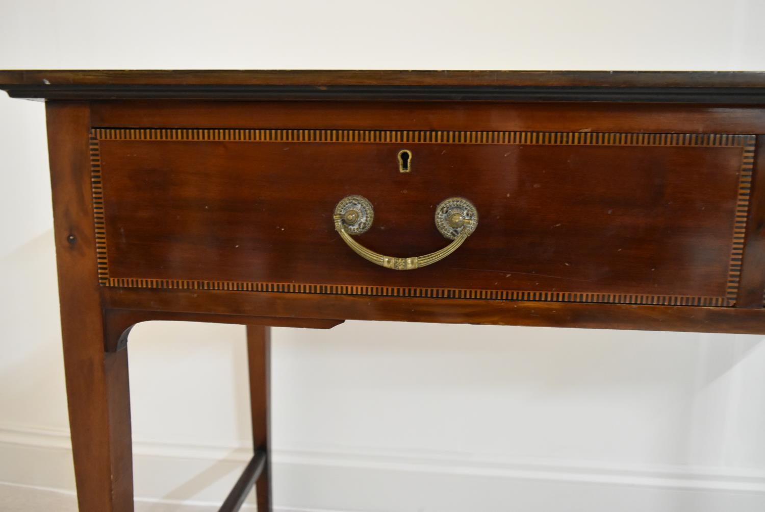 An Edwardian inlaid mahogany two drawer hall table raised on tapering supports terminating in pad - Image 8 of 14