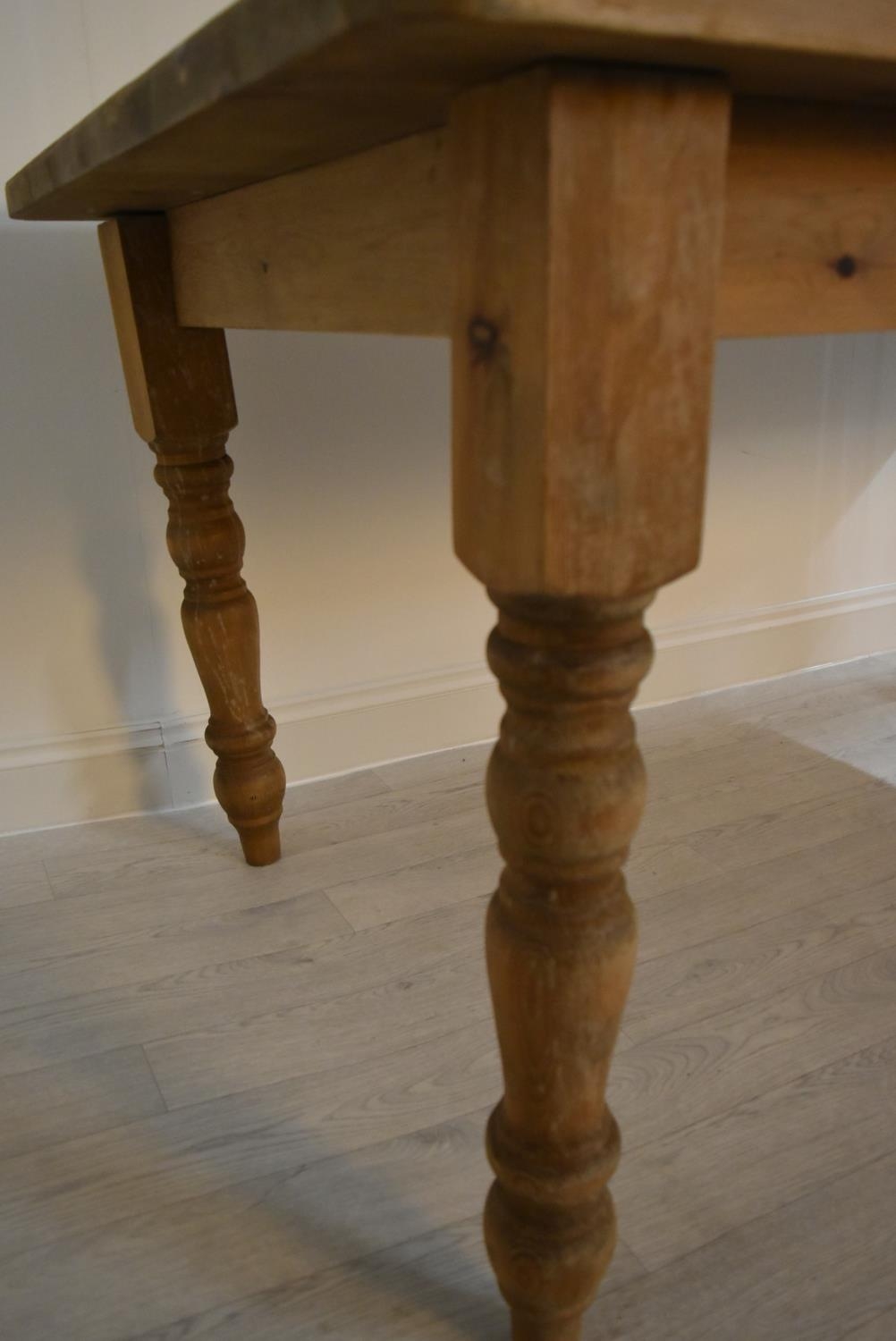 A rectangular pine farmhouse style kitchen table raised on turned supports. H.77 W.183 D.92cm - Image 6 of 6