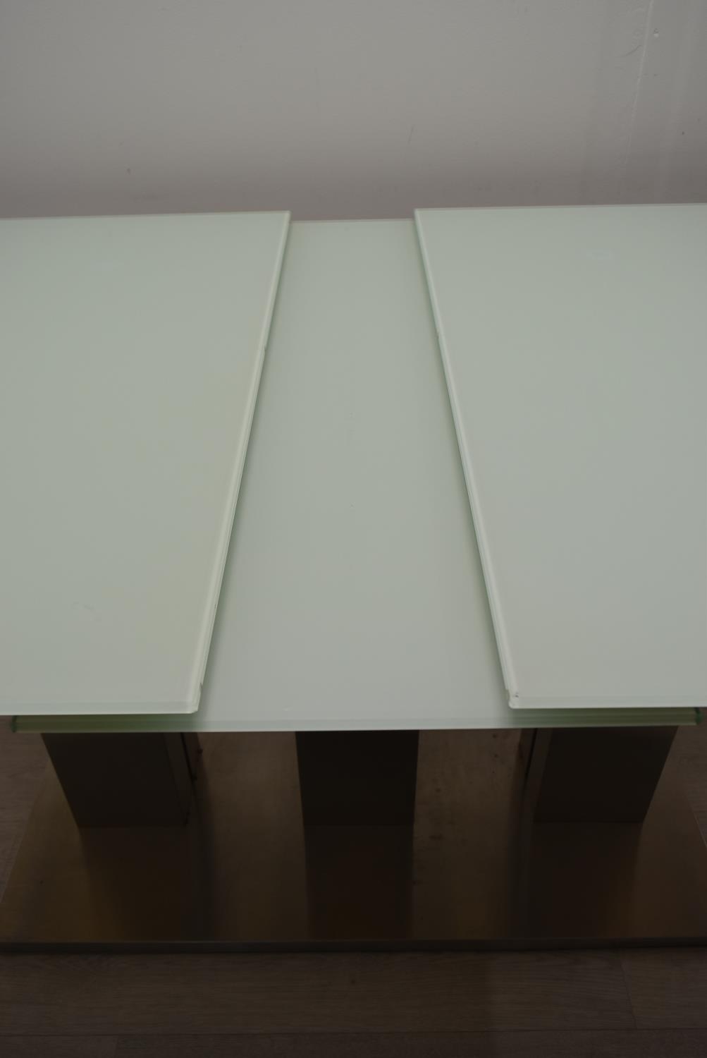 A contemporary extending glass dining table on brushed metal base. H.76 W.221 D.90cm - Image 12 of 21