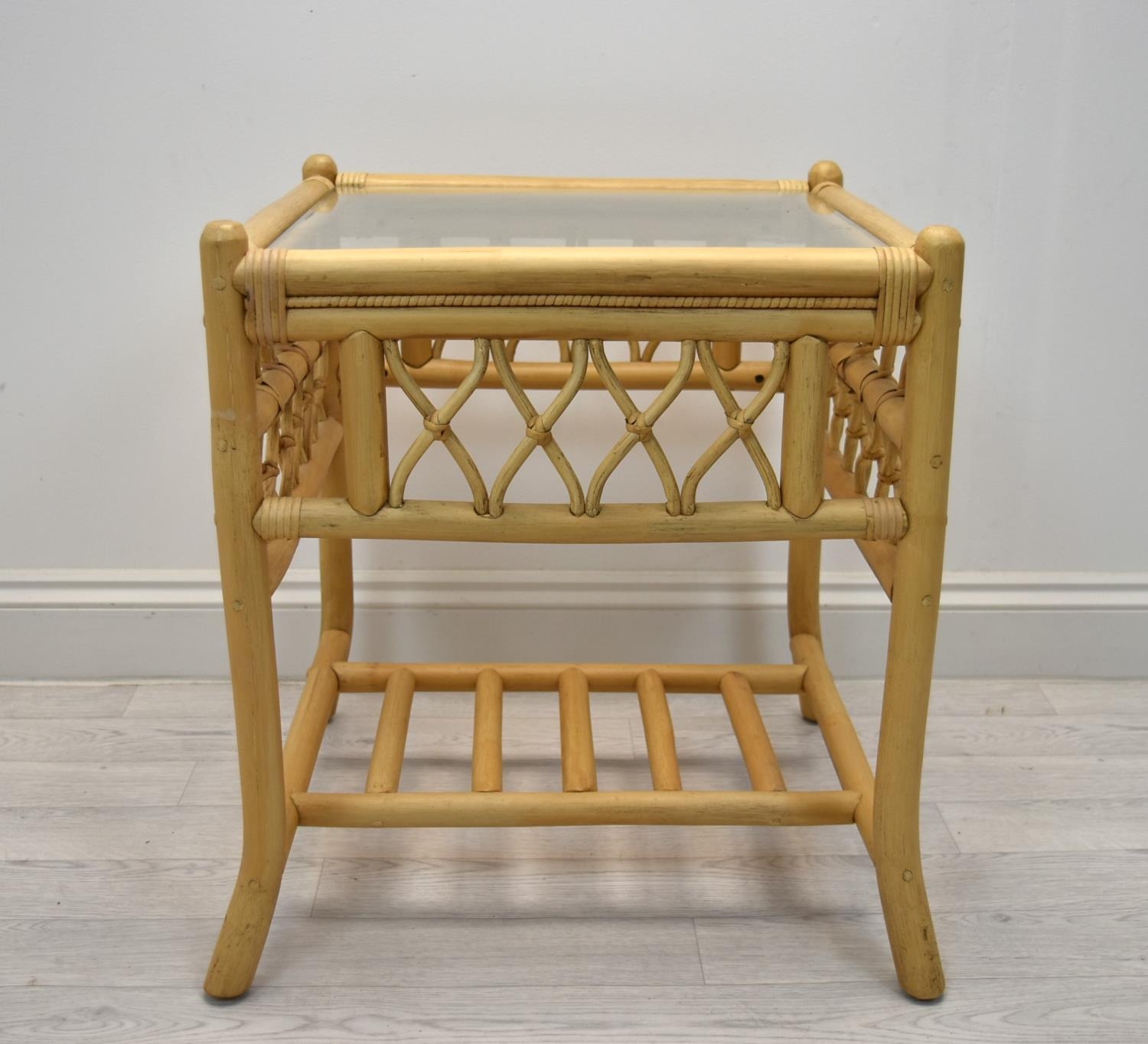 A contemporary bamboo framed glass topped conservatory table. H.59 W.51 D.51cm