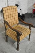 A late 17th century carved oak throne chair in tartan upholstery. 69cm H x 67cm D x 110cm H.